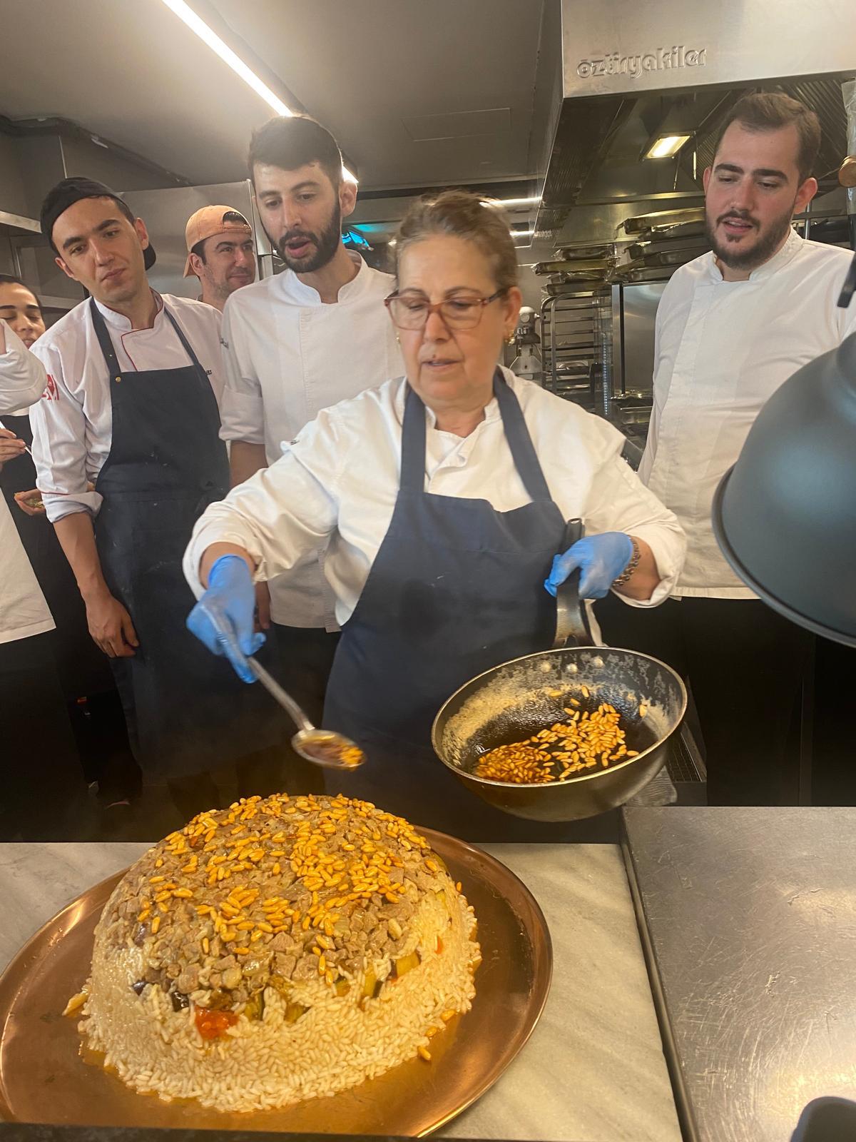Our chef preparing rice pilaf with pine nuts